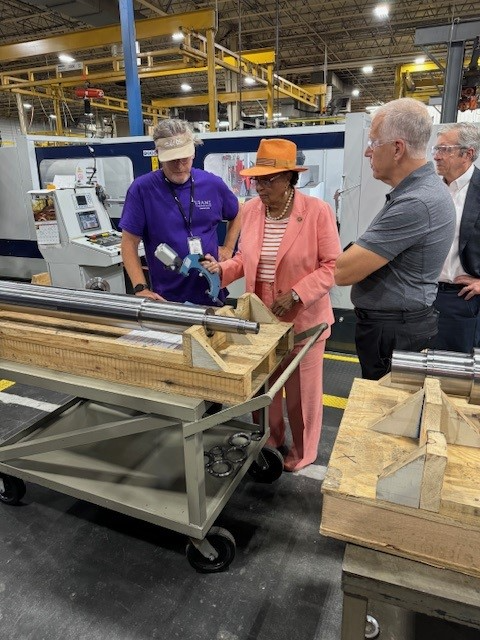 Rep. Adams examining tools