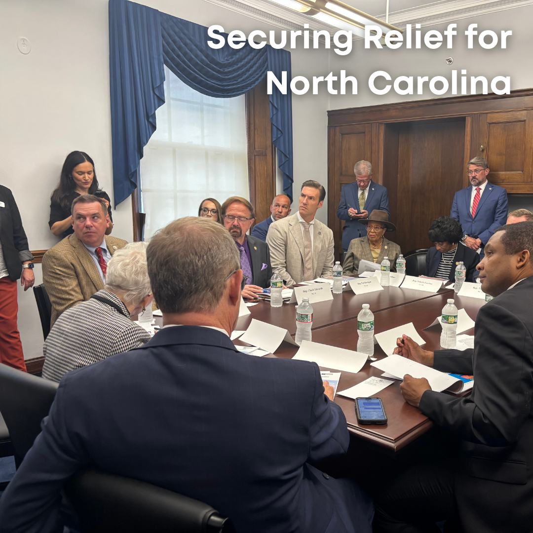 Rep. Adams sits at a table with other members of Congress