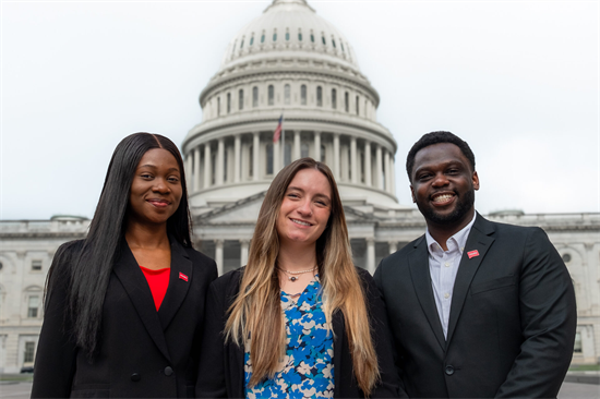 Students pose in front of Capitol Dome